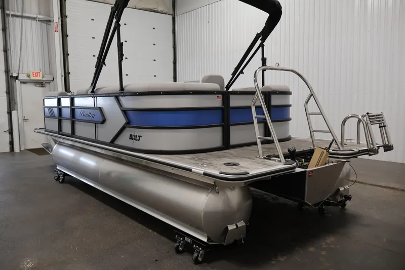 Slide: The Image of 2026 Bentley Pontoons 203 Bolt Tri-Toon in a showroom, showcasing sleek design and modern features. - 6