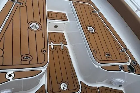 Slide: The Image of 2022 Sea Hunt Gamefish 30 Forward Seating deck with brown and white detailing. - 11