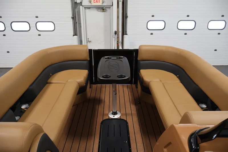 Slide: The Image of 2026 Bentley Pontoons Elite 253 helm with dual captain chairs, featuring advanced controls and Simrad display. - 10