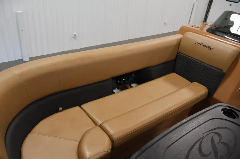 Slide: The Image of 2026 Bentley Pontoons Elite 253 interior with dual captain chairs and steering wheel. - 14