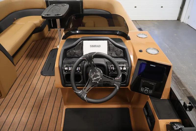 Slide: The Image of Interior of 2026 Bentley Pontoons Elite 253 with tan seating and black table. - 20