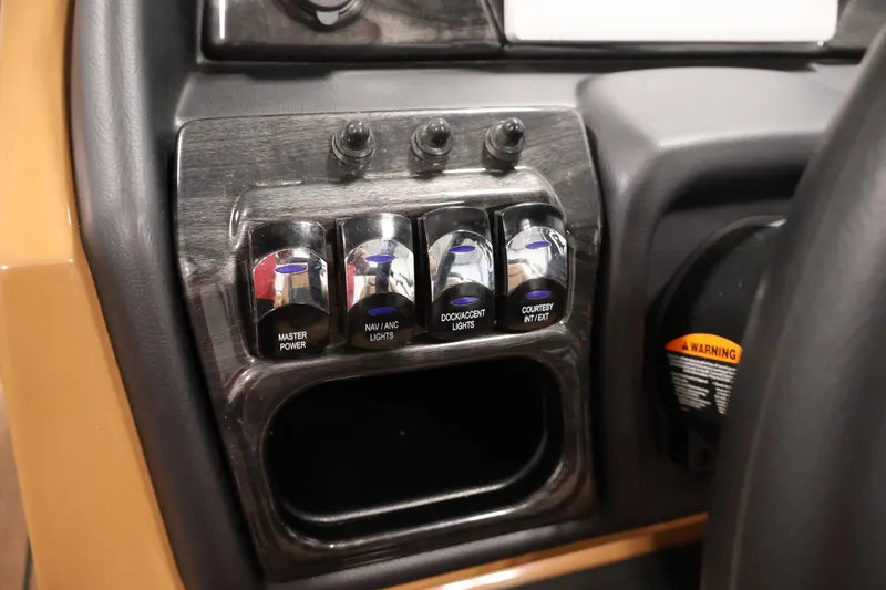 Slide: The Image of 2026 Bentley Pontoons Elite 253 interior with dual captain chairs and luxurious seating. - 23