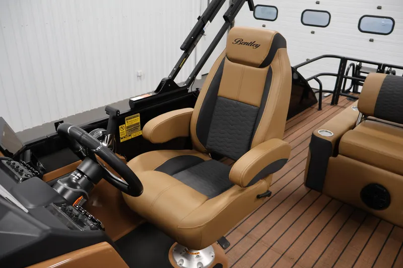Slide: The Image of Luxurious seating on 2026 Bentley Pontoons Elite 253 Swingback Tri-Toon, featuring dual captain chairs. - 29
