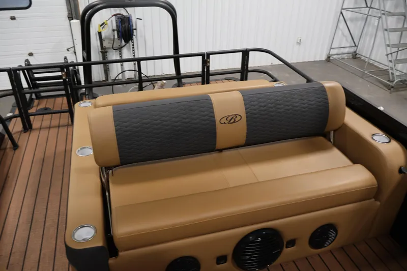 Slide: The Image of 2026 Bentley Pontoons Elite 253 dashboard with Simrad display and Rockford Fosgate audio system. - 31