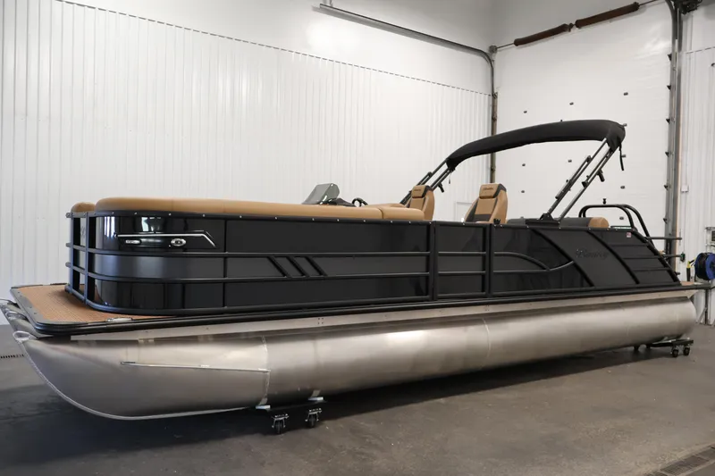 Slide: The Image of 2026 Bentley Pontoons Elite 253 Swingback storage compartment with open lid and speaker system. - 7