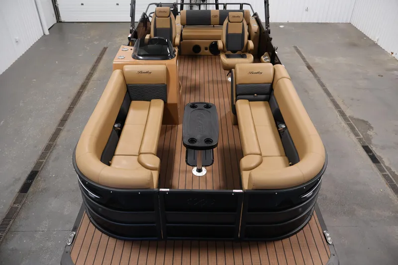 Slide: The Image of 2026 Bentley Pontoons Elite 253 Swingback with luxurious dual captain chairs and tri-toon design. - 8