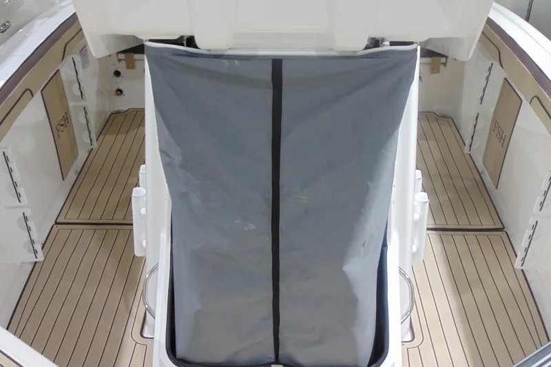 Slide: The Image of 2026 Yamaha Boats 255 FSH Sport H interior with sleek deck and storage area. - 25