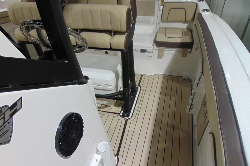 Slide: The Image of Interior view of 2026 Yamaha Boats 255 FSH Sport H, featuring beige seating and sleek design. - 27