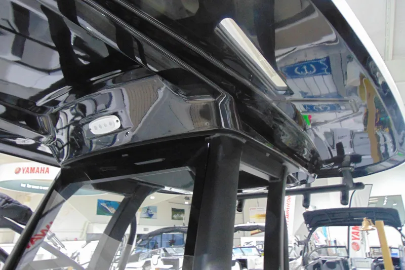 Slide: The Image of 2026 Yamaha Boats 255 FSH Sport H, sleek black interior detail. - 28