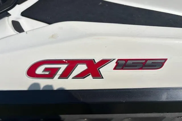 Slide: The Image of 2010 Sea-Doo GTX 155 logo on white surface, close-up view. - 12