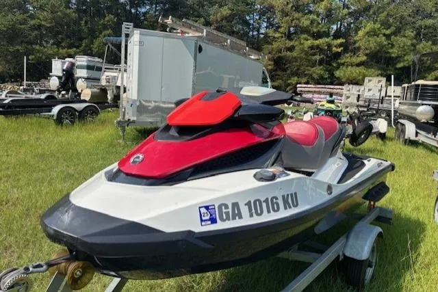 Slide: The Image of 2010 Sea-Doo GTX 155 jet ski on trailer, parked on grass. - 6