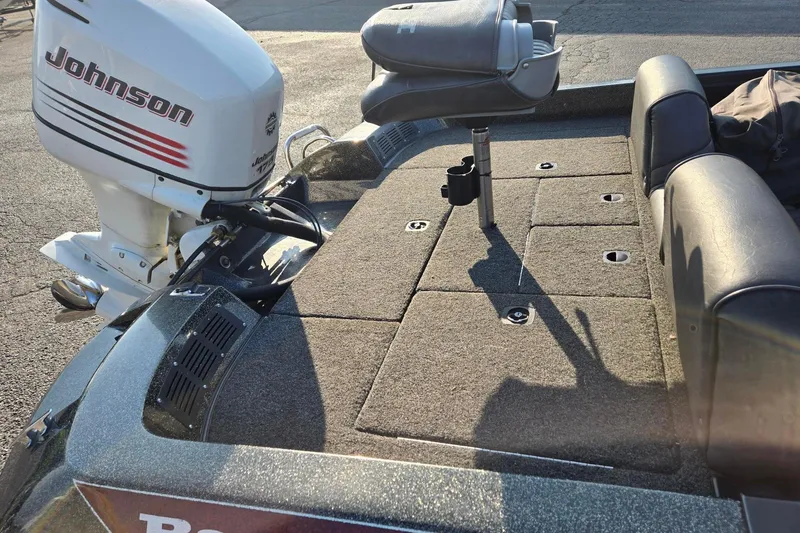 Slide: The Image of 1993 Boomeranger 482V boat with Johnson outboard motor and cushioned seating. - 7