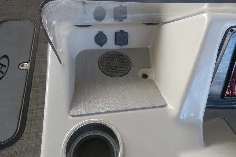 Slide: The Image of 2023 Harris Sunliner 250 boat console with cup holder and speaker. - 10