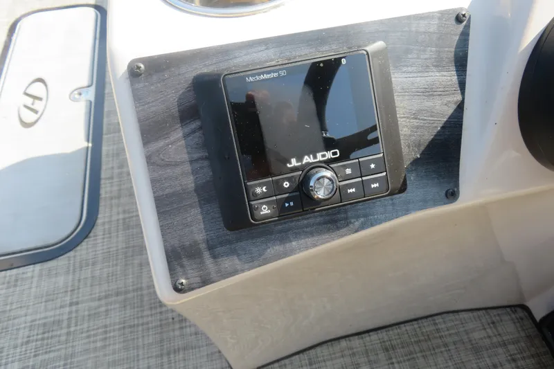 Slide: The Image of JL Audio system on 2023 Harris Sunliner 250 boat dashboard. - 11