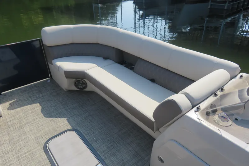 Slide: The Image of 2023 Harris Sunliner 250 boat interior with plush seating and modern design. - 3