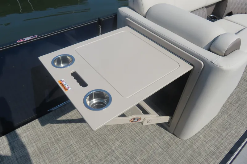 Slide: The Image of 2023 Harris Sunliner 250 boat with foldable table and cup holders. - 5