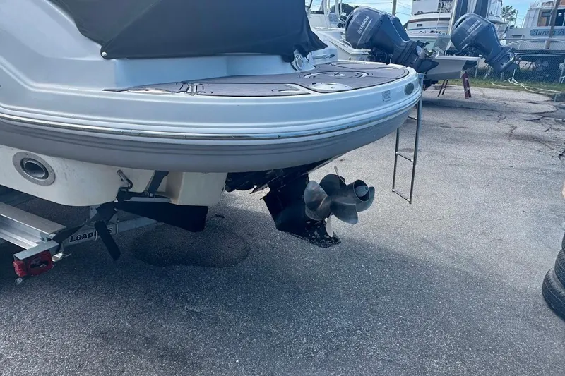 Slide: The Image of 2010 Chaparral 275 SSi boat stern with propeller and ladder on trailer. - 2