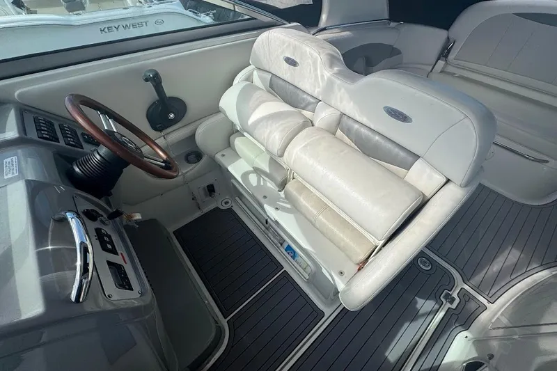 Slide: The Image of 2010 Chaparral 275 SSi boat interior with steering wheel and seating area. - 8