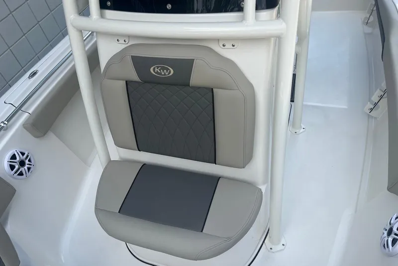 Slide: The Image of 2026 Key West 219 FS boat seat with gray and black cushioned design. - 16