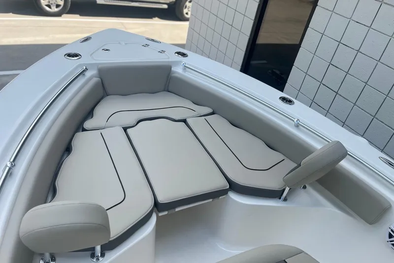 Slide: The Image of 2026 Key West 219 FS boat interior with cushioned seating and sleek design. - 18