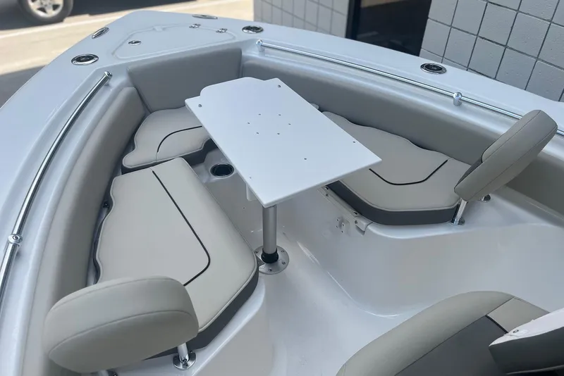 Slide: The Image of 2026 Key West 219 FS boat interior with seating and table setup. - 19