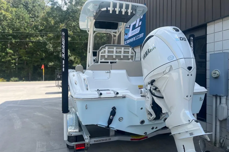 Slide: The Image of 2026 Key West 219 FS boat with Yamaha engine, parked outdoors. - 3