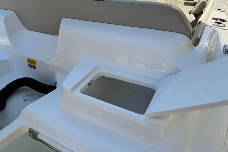 Slide: The Image of 2026 Key West 219 FS boat interior with open storage compartment. - 4