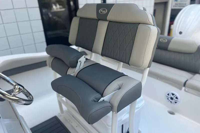 Slide: The Image of 2026 Key West 219 FS boat seating with gray and beige upholstery. - 7