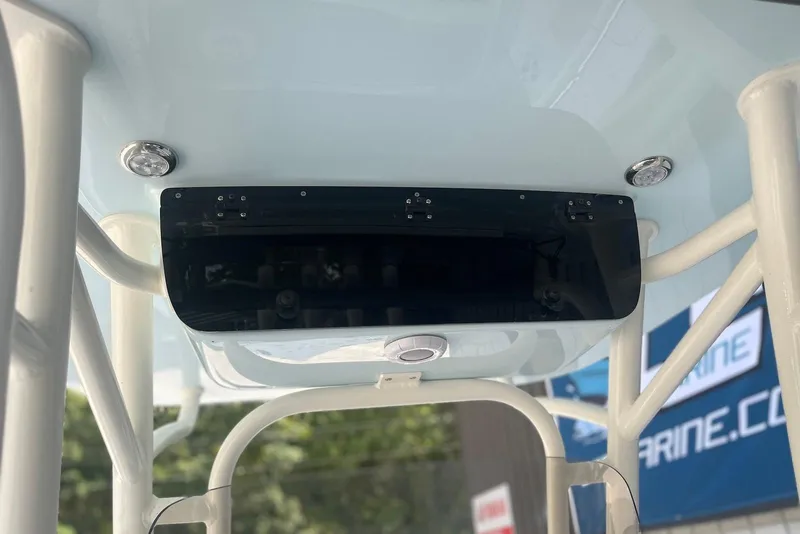 Slide: The Image of 2026 Key West 219 FS boat T-top with integrated lights and storage compartment. - 8