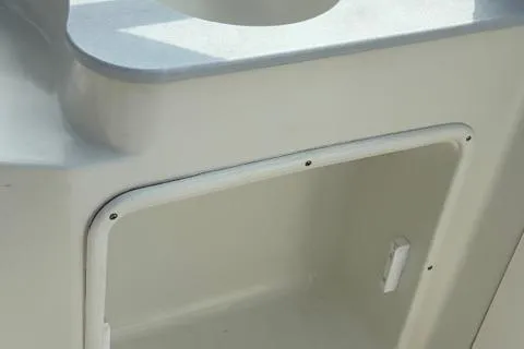 Slide: The Image of 2005 Stingray 220 DR boat interior storage compartment detail. - 8