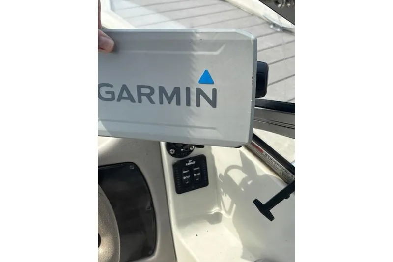 Slide: The Image of Garmin device on 2005 Stingray 220 DR boat dashboard. - 9