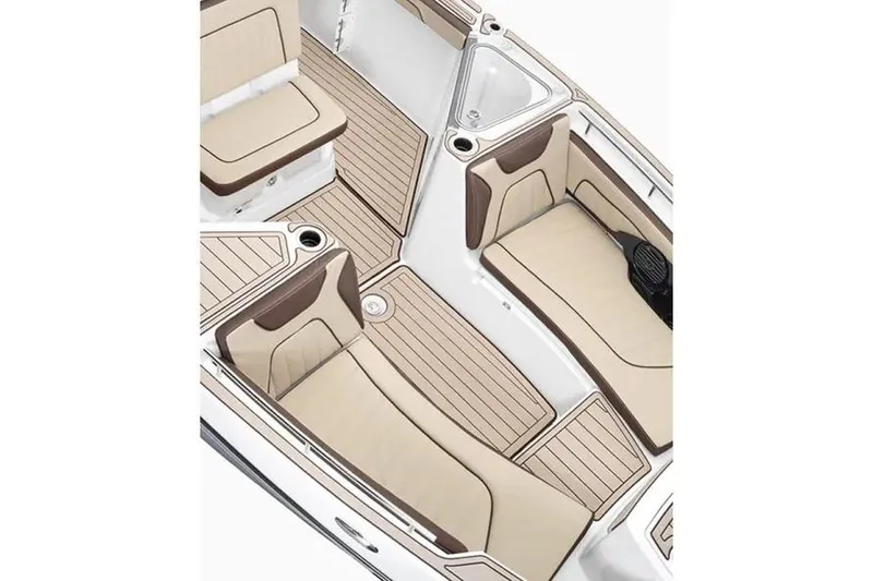 Slide: The Image of 2026 Yamaha Boats 255 FSH Sport E interior with beige seating and wood-style flooring. - 5