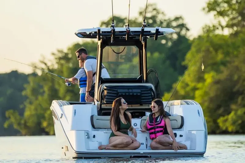 Slide: The Image of 2026 Yamaha Boats 255 FSH Sport E on water, people fishing and relaxing. - 7