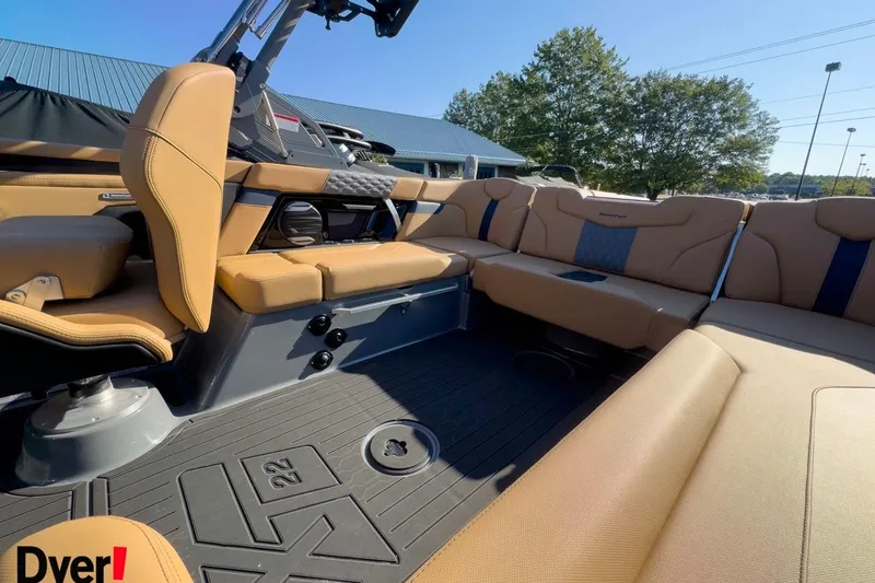 Slide: The Image of 2026 MasterCraft XT22 boat interior with tan seating and modern design. - 10