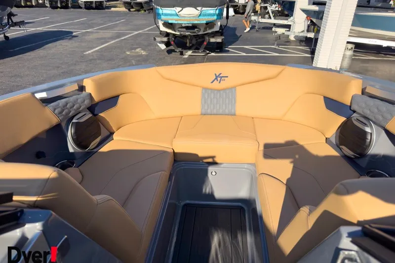 Slide: The Image of 2026 MasterCraft XT22 boat interior with tan seating and modern design. - 12