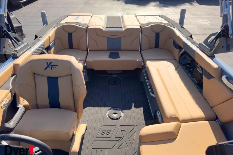 Slide: The Image of 2026 MasterCraft XT22 boat interior with tan seating and modern design. - 13