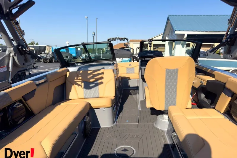 Slide: The Image of 2026 MasterCraft XT22 boat interior with tan seating and modern design. - 8