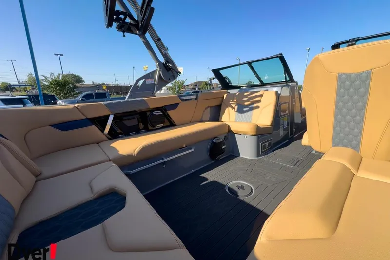 Slide: The Image of 2026 MasterCraft XT22 boat interior with tan seating and modern design. - 9
