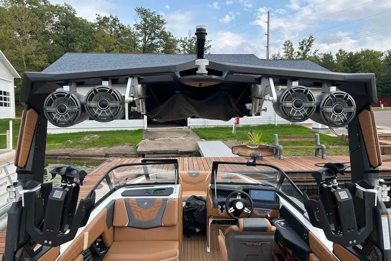 Slide: The Image of 2022 Nautique Super Air Nautique G21 boat with advanced sound system and luxurious interior. - 4