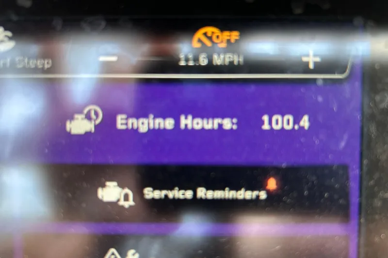 Slide: The Image of Dashboard display of 2022 Nautique Super Air Nautique G21 showing 100.4 engine hours. - 6