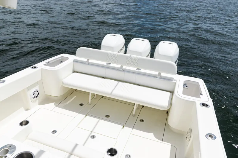 Slide: The Image of 2017 SeaVee 370z boat with triple outboard engines on open water. - 28