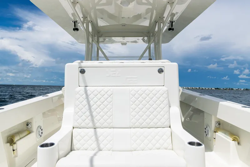 Slide: The Image of 2017 SeaVee 370z boat interior with white seating, ocean view, and blue sky. - 30