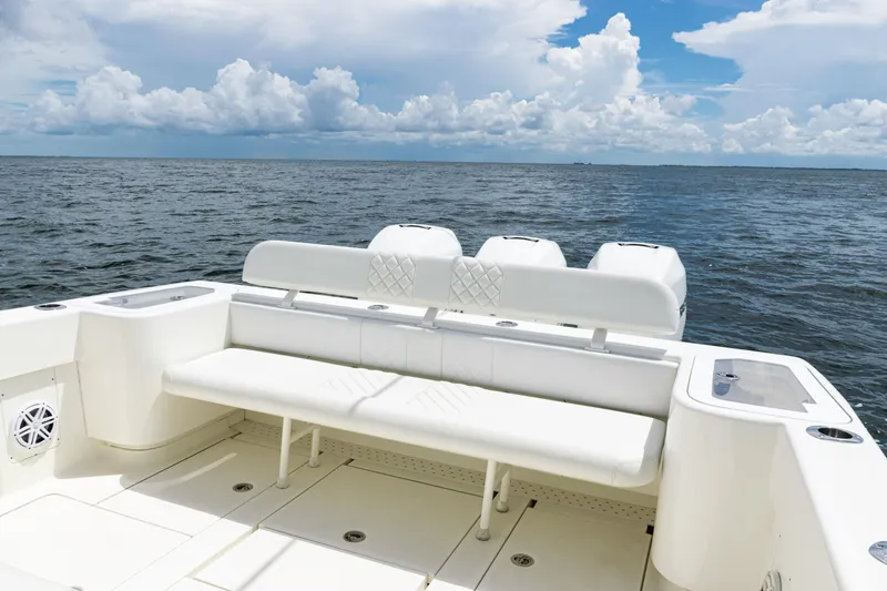Slide: The Image of 2017 SeaVee 370z boat with white seating, ocean view, and cloudy sky. - 37