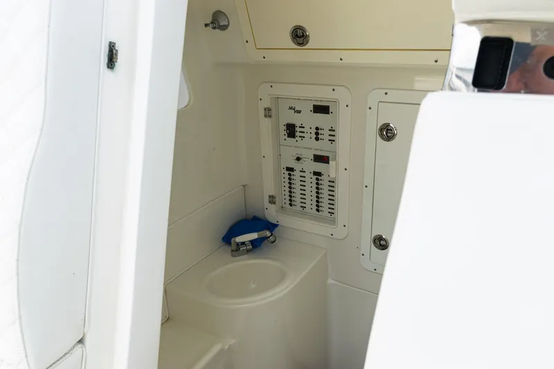 Slide: The Image of 2017 SeaVee 370z interior with control panel and compact sink. - 38