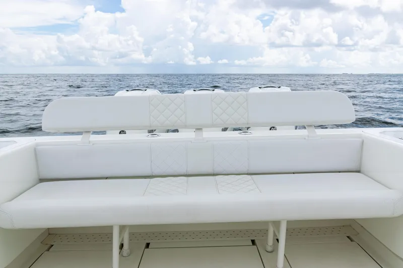 Slide: The Image of 2017 SeaVee 370z boat with white seating, ocean view, and cloudy sky. - 39