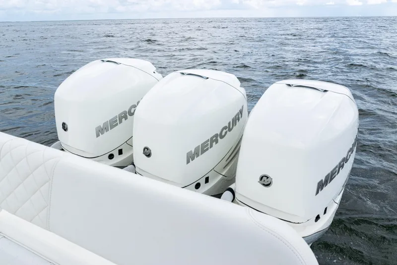 Slide: The Image of Triple Mercury outboard engines on a 2017 SeaVee 370z boat in open water. - 40
