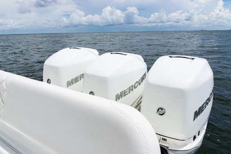Slide: The Image of 2017 SeaVee 370z boat with triple Mercury outboard engines on open water. - 41