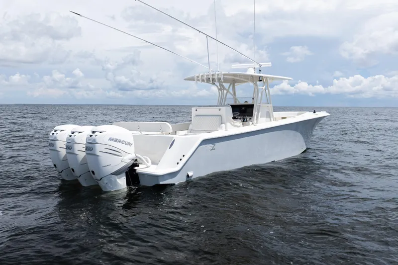 Slide: The Image of 2017 SeaVee 370z boat with triple Mercury engines on open water. - 42