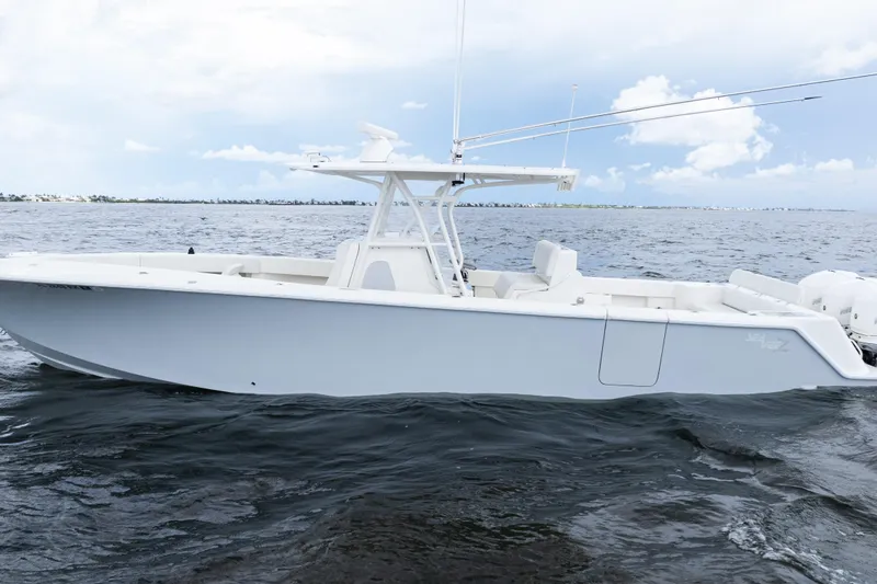 Slide: The Image of 2017 SeaVee 370z boat on open water, showcasing sleek design and spacious deck. - 43