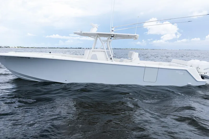 Slide: The Image of 2017 SeaVee 370z boat on open water under a cloudy sky. - 44